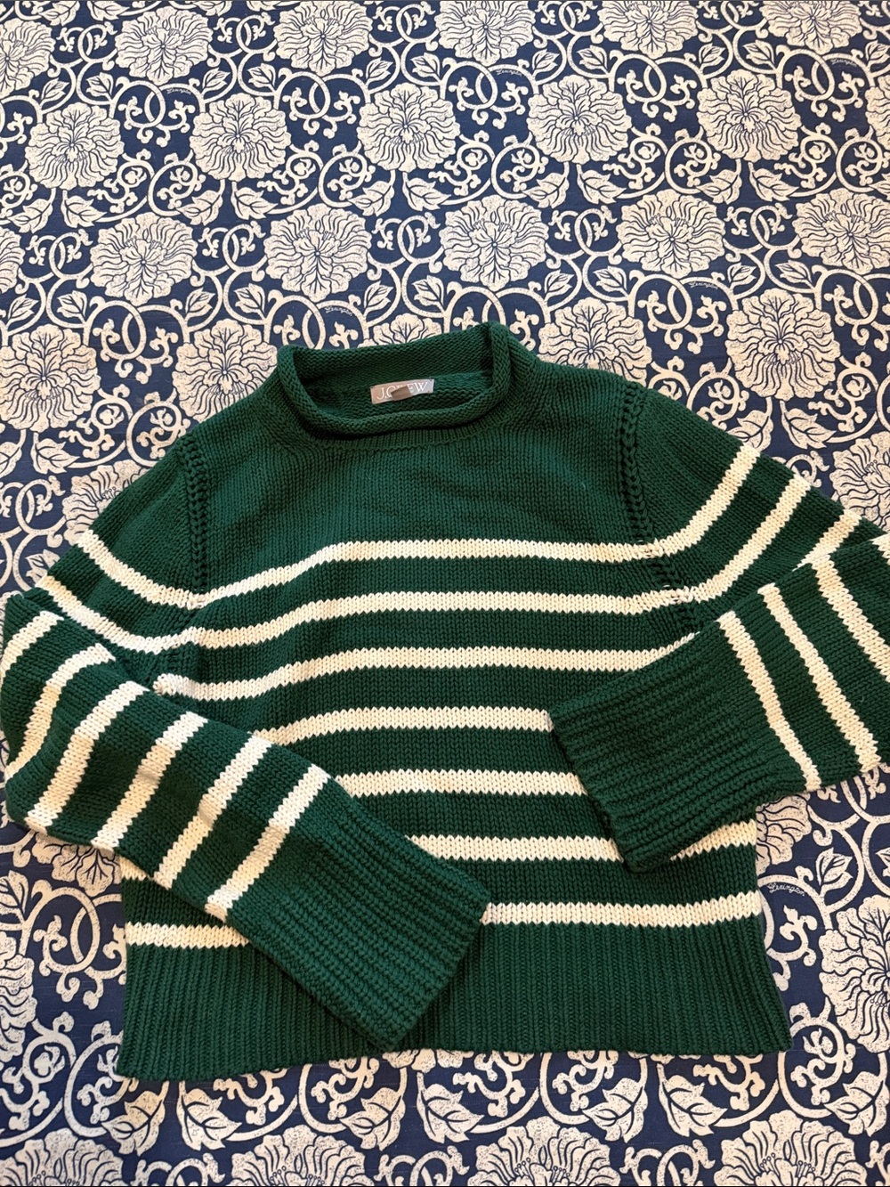 Jcrew cropped green and white striped roll neck sweater.